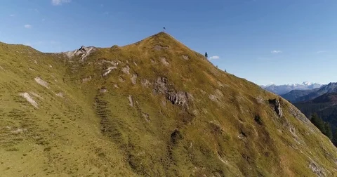 Cinematic green alpine mountain summit peak sunny summer day. Austria. Drone fly Stock Footage 80922810