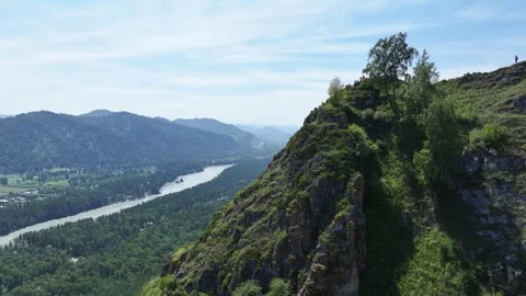 Cinematic Green Peak Overlooking The River Stock Footage 259695626