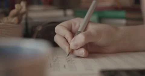Cinematic a hand writing music notes on sheet with pencil, music education Stock Footage 346746523