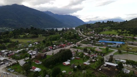 Cinematic High Aerial Pull-Away of Remote Village in Patagonian Valley and Fjord 库存影片 333123505