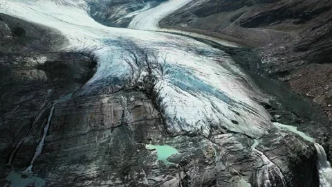 Cinematic High-Angle Aerial Tracking Shot of Swiss Alps Glacier Surface Melting Stock Footage 341699942