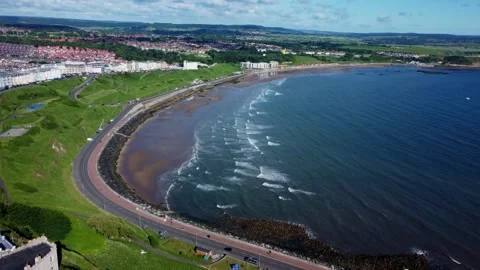 Cinematic High Drone Flight Departing From Scarborough Castle Along North Bay 库存影片 341323657