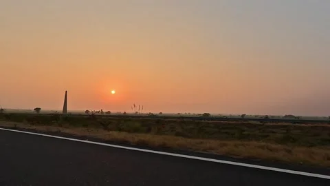 Cinematic highway road trip during sunset with orange sky. Stock Footage 339727487