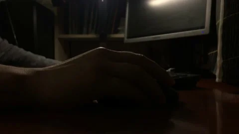 Cinematic home worker at the computer does the work remotely. Ending work. Stockbeeldmateriaal 131443726