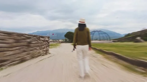 Cinematic hyperlapse POV following tracking woman traveler visitor through .. Stock-Footage 333579832