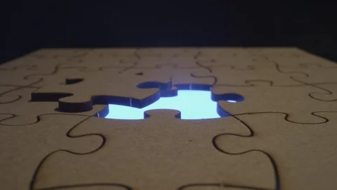 Cinematic imagery missing puzzle piece solving a crime or autism awareness Stock Footage 129338372