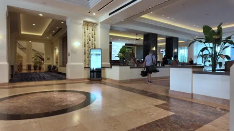 Cinematic interior shot of an upscale hotel lobby featuring premium finishes Stock Footage 340535958