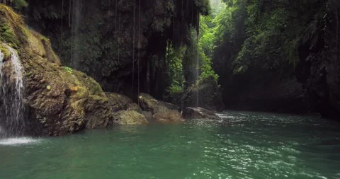 Cinematic Jungle River Flow with Soft Light and Natural Rock Texture Stock Footage 332653116
