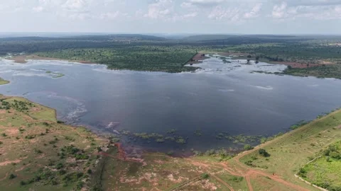Cinematic-left-pan-drone-shot-over-wetland-lake-and-rural-landscape Stock Footage 341590137
