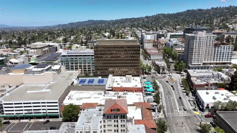 Cinematic leftward drone movement over Berkeley, California, featuring downtown Stock Footage 340576560