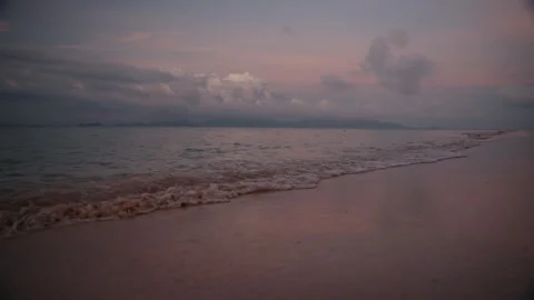 Cinematic Low-Angle Drone Flight over Gentle Ocean Waves at Sunset, Dreamy Pink Vídeos de archivo 335713592