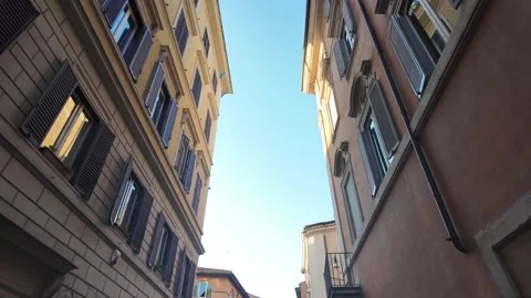 Cinematic low angle looking up at historic Roman facades in the city center Stock Footage 342174522