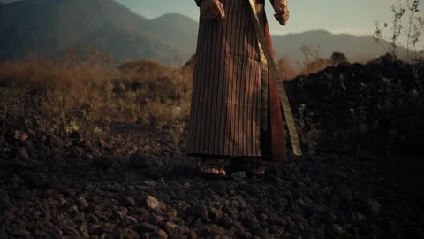 Cinematic Low Angle of Man Walking in Ethnic Wear Stock Footage 268976670