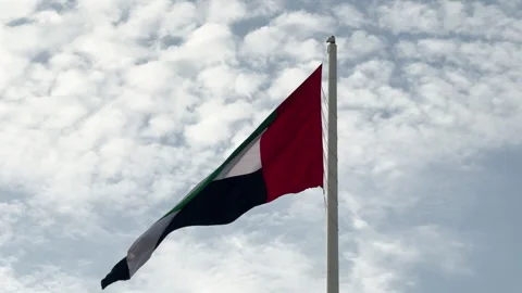 Cinematic Low Angle Shot of UAE Flag at Against the Sky 스톡 동영상 332554179