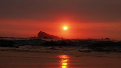 Cinematic Low Angle Sunset over Tropical Beach with Sea Silhouette Stock Footage 331968458