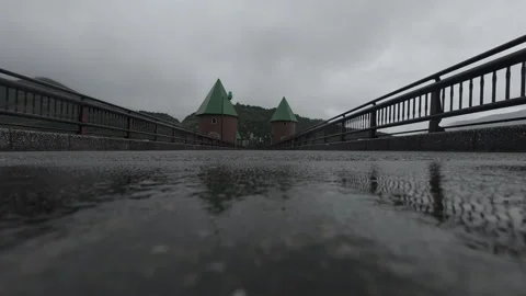Cinematic Low Angle Symmetrical Bridge Reflection in Rain 4K B-Roll Stock Footage 342384628