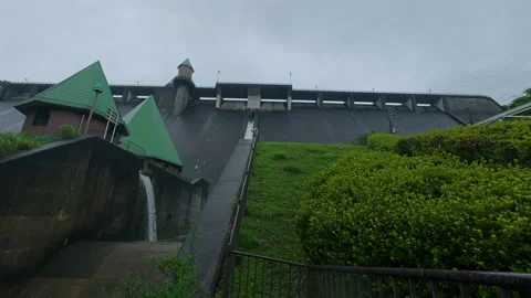 Cinematic Low Angle View of Massive Dam Concrete Wall in Rain 4K B-Roll Stock Footage 342320988