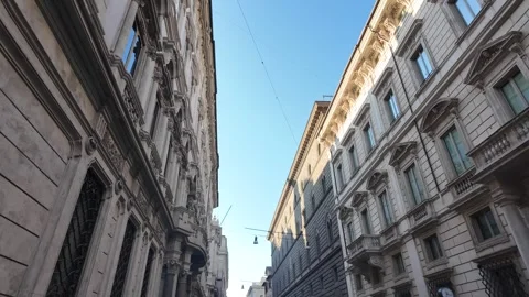 Cinematic low angle walking shot along the historic Via del Corso in Rome Stock Footage 341980835