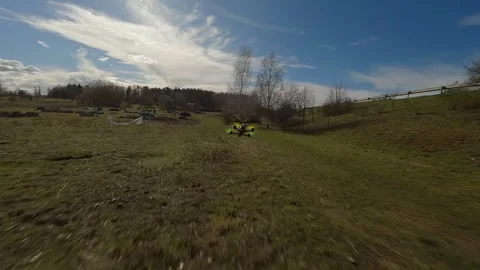 Cinematic Low FPV Drone Chase over Open Meadow 스톡 동영상 313762884