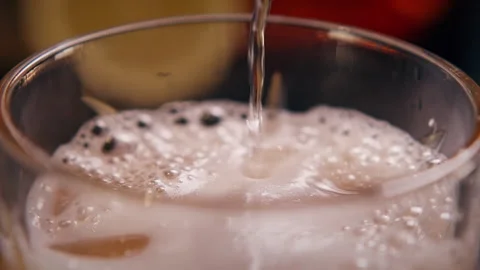 Cinematic Macro of Fizzy Cola with Bubbles and Foam in Glass Stock Footage 328978413