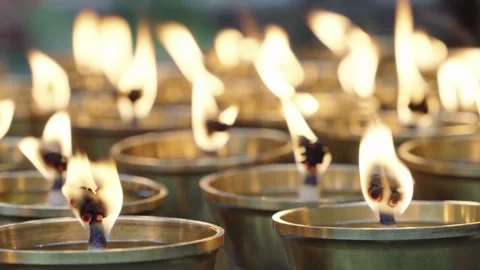 Cinematic Macro Glowing Red Charcoal Fire and Lotus Candles Stock Footage 336951763
