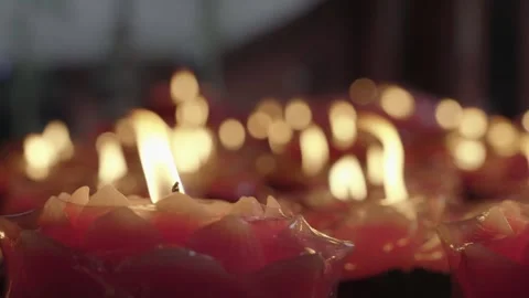 Cinematic Macro Glowing Red Charcoal Fire and Lotus Candles Stock Footage 336952185
