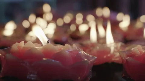 Cinematic Macro Glowing Red Charcoal Fire and Lotus Candles Stock Footage 336952196