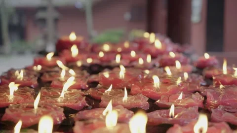 Cinematic Macro Glowing Red Charcoal Fire and Lotus Candles 库存影片 336952304