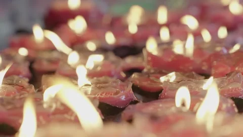 Cinematic Macro Glowing Red Charcoal Fire and Lotus Candles 스톡 동영상 336952402