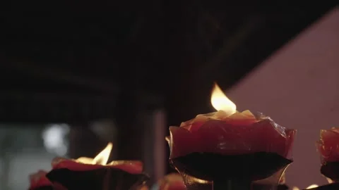 Cinematic Macro Glowing Red Charcoal Fire and Lotus Candles Stock Footage 336952499
