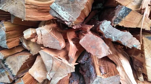 Cinematic macro shot of stacked split firewood logs Видео 346787928