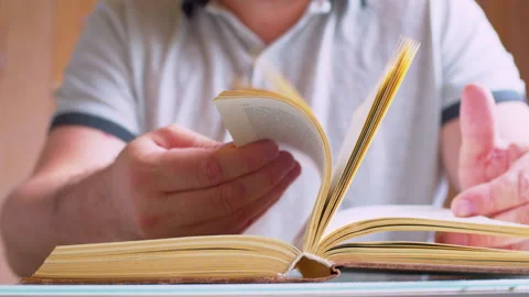 Cinematic macro shot of turning old book pages Stock Footage 336199458