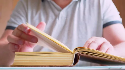 Cinematic macro shot of turning old book pages Stock Footage 336209477