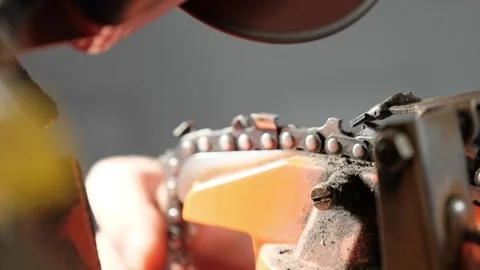 Cinematic Macro Slow Motion of Electric Grinder Sharpening Steel Chainsaw Chain Stock Footage 326496559