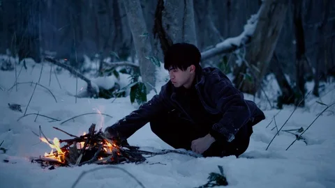 Cinematic - Man and Fire in Winter Forest Stock Footage 100875199
