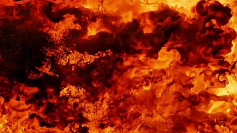 Cinematic massive fire explosion and slow motion flames on black background Stock Footage 333484575
