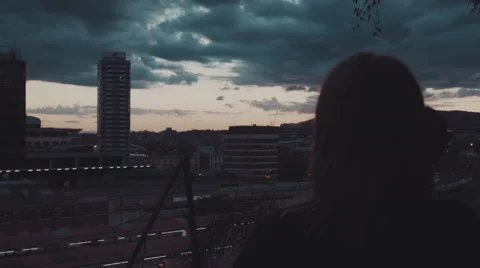 Cinematic Medium OTS Shot of a Woman looking at the City Stock Footage