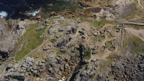 Cinematic, meticulously framed,. Castro de Baroña. Dynamic top down aerial Stock Footage 248112818