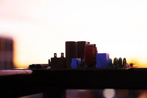 Cinematic Moody Close-up of Electronic Components at Sunset Stock Photos