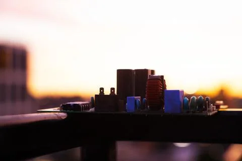 Cinematic Moody Close-up of Electronic Components at Sunset Stock Photos