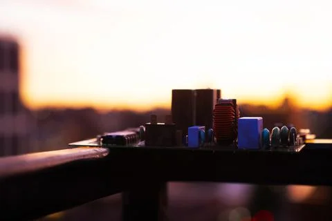 Cinematic Moody Close-up of Electronic Components at Sunset Stock Photos