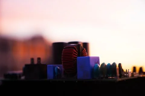 Cinematic Moody Close-up of Electronic Components at Sunset Stock Photos