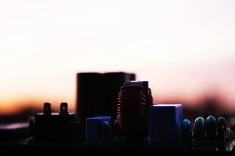 Cinematic Moody Close-up of Electronic Components at Sunset Stock Photos