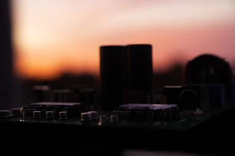 Cinematic Moody Close-up of Electronic Components at Sunset Stock Photos