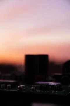 Cinematic Moody Close-up of Electronic Components at Sunset Stock Photos