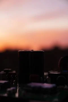 Cinematic Moody Close-up of Electronic Components at Sunset Stock Photos