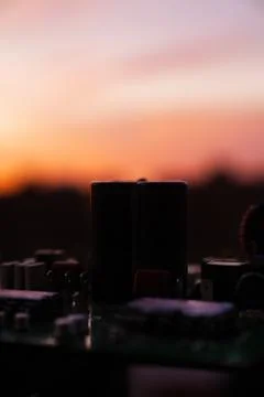 Cinematic Moody Close-up of Electronic Components at Sunset Stock Photos