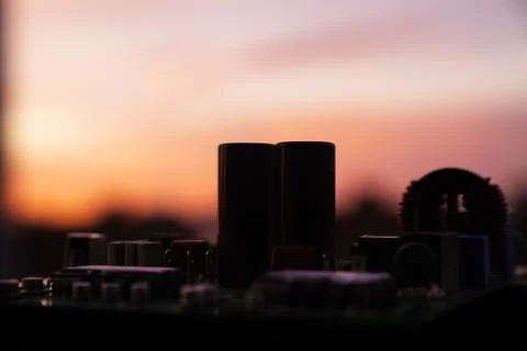 Cinematic Moody Close-up of Electronic Components at Sunset Stock Photos