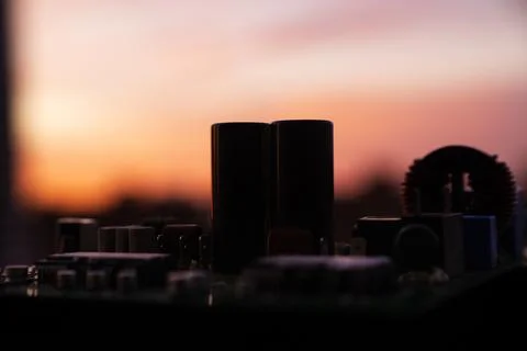Cinematic Moody Close-up of Electronic Components at Sunset Stock Photos