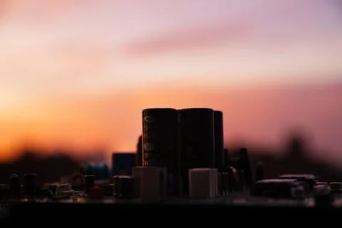 Cinematic Moody Close-up of Electronic Components at Sunset Stock Photos